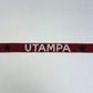 Red band with 'UTAMPA' text and stars on a white background